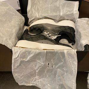 New Coach running shoes in black and grey. Shoes are in pristine condition.